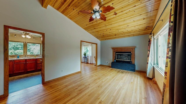 N2493 Kunz Rd, Fort Atkinson, WI 53538 - unfurnished living room with vaulted ceiling, light wood-type flooring, wooden ceiling, ceiling fan, and a brick fireplace