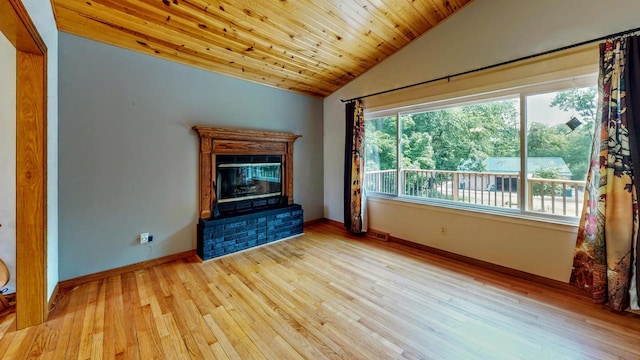 N2493 Kunz Rd, Fort Atkinson, WI 53538 - unfurnished living room with vaulted ceiling, wood finished floors, wooden ceiling, and a glass covered fireplace