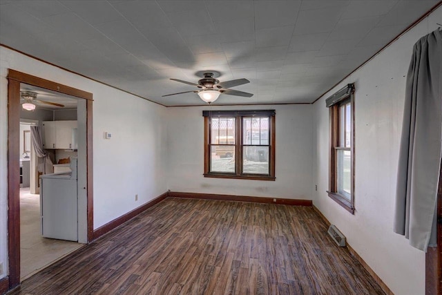500 2nd Ave, Hollandale, WI 53544 - unfurnished room with ceiling fan and dark wood-type flooring