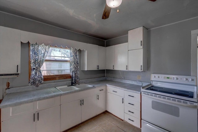 500 2nd Ave, Hollandale, WI 53544 - kitchen featuring white electric stove, light countertops, and white cabinetry
