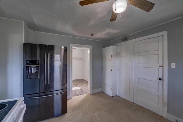500 2nd Ave, Hollandale, WI 53544 - kitchen with fridge with ice dispenser, a ceiling fan, white stove, and light tile patterned floors