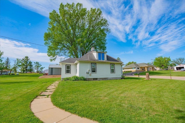 500 2nd Ave, Hollandale, WI 53544 - view of front of property featuring a front lawn and a chimney