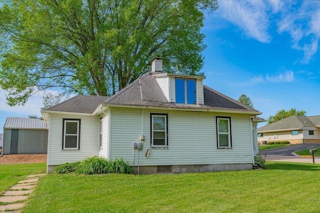500 2nd Ave, Hollandale, WI 53544 - back of property featuring a yard, a chimney, and roof with shingles