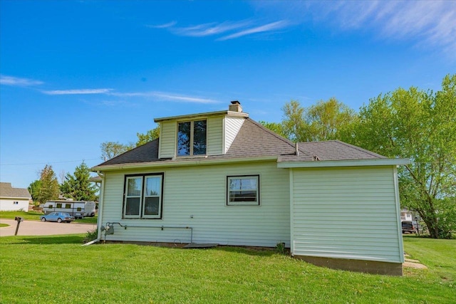 500 2nd Ave, Hollandale, WI 53544 - back of house featuring a yard and a chimney