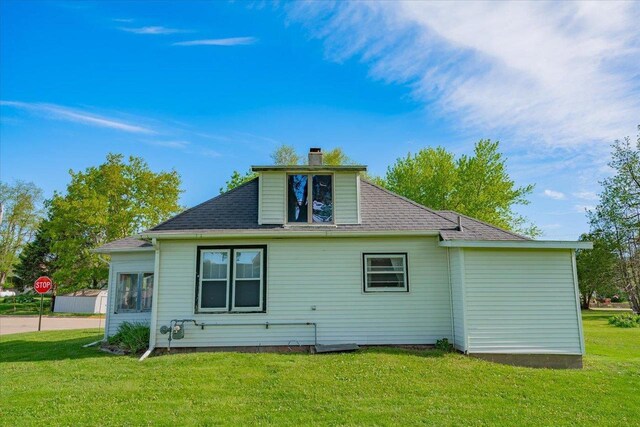 500 2nd Ave, Hollandale, WI 53544 - rear view of property featuring a lawn and a chimney