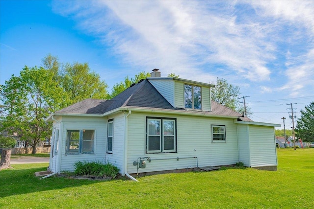 500 2nd Ave, Hollandale, WI 53544 - rear view of house featuring a yard, a chimney, and a shingled roof