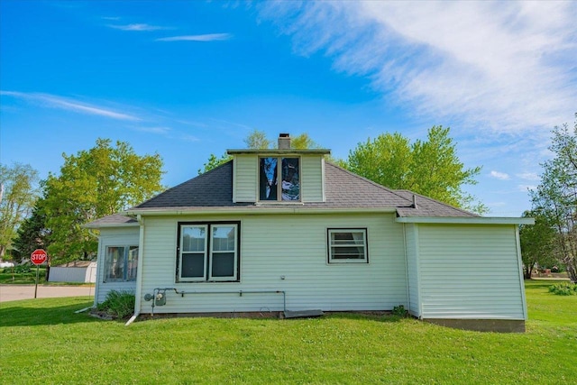 500 2nd Ave, Hollandale, WI 53544 - rear view of property featuring a lawn and a chimney