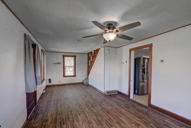 500 2nd Ave, Hollandale, WI 53544 - spare room with wood finished floors, ceiling fan, stairs, and a smoke detector