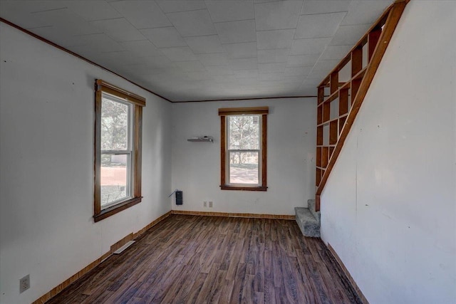 500 2nd Ave, Hollandale, WI 53544 - unfurnished room with healthy amount of natural light, wood finished floors, and ornamental molding