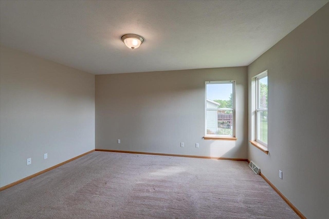 862 Stonefield Dr, Edgerton, WI 53534 - carpeted spare room featuring baseboards