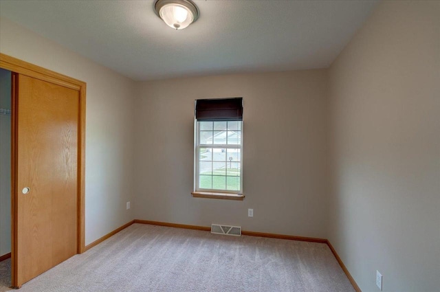 862 Stonefield Dr, Edgerton, WI 53534 - unfurnished bedroom featuring light colored carpet and a closet