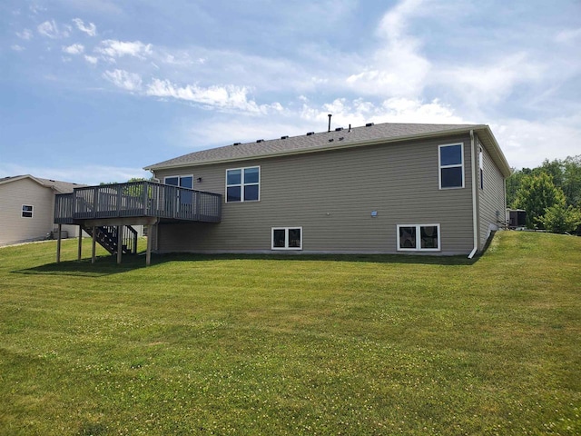 862 Stonefield Dr, Edgerton, WI 53534 - back of property featuring stairs, a wooden deck, and a yard