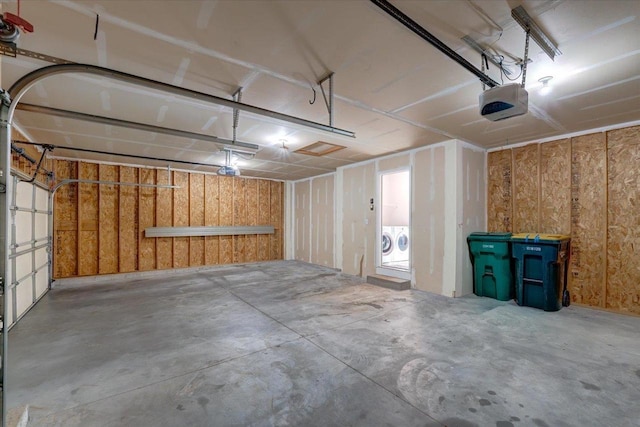 862 Stonefield Dr, Edgerton, WI 53534 - garage with a garage door opener and washing machine and dryer