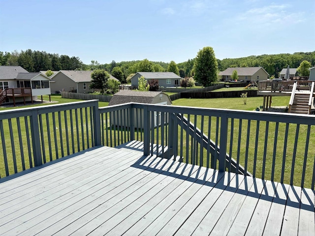 862 Stonefield Dr, Edgerton, WI 53534 - wooden deck featuring a storage unit, a residential view, and a fenced backyard