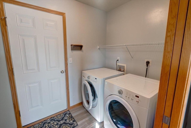 862 Stonefield Dr, Edgerton, WI 53534 - laundry room with washing machine and clothes dryer and light wood-type flooring