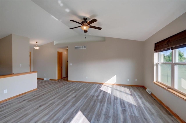 862 Stonefield Dr, Edgerton, WI 53534 - unfurnished room featuring light wood-type flooring, lofted ceiling, and a ceiling fan
