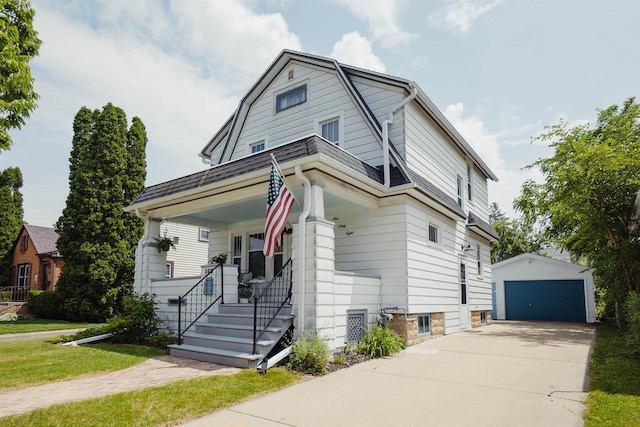 168 14th St, Fond Du Lac, WI 54935 - colonial inspired home with an outdoor structure, covered porch, a garage, a gambrel roof, and a front yard