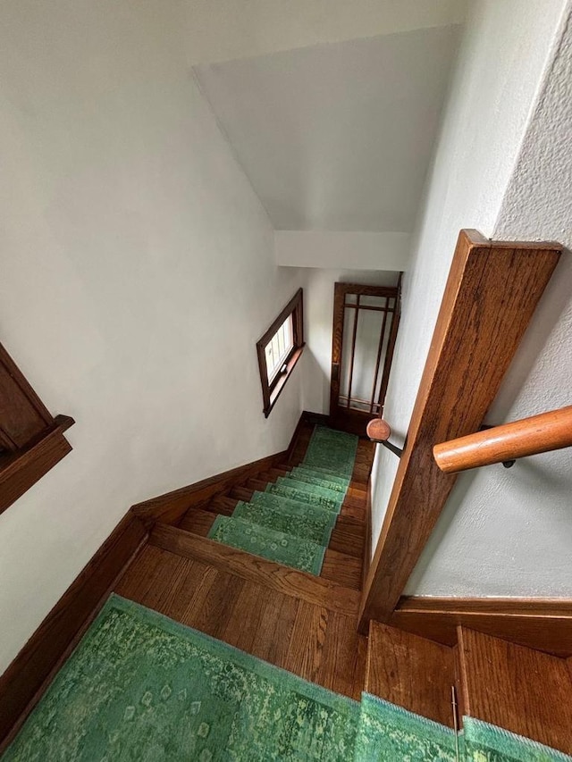 168 14th St, Fond Du Lac, WI 54935 - staircase with baseboards and parquet flooring