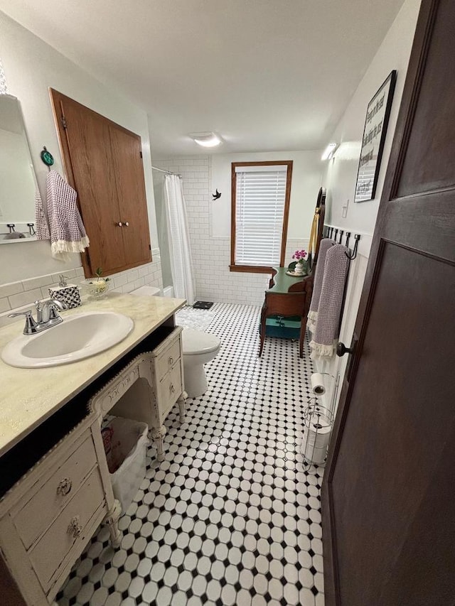 168 14th St, Fond Du Lac, WI 54935 - bathroom featuring vanity, a shower with curtain, and tile patterned floors