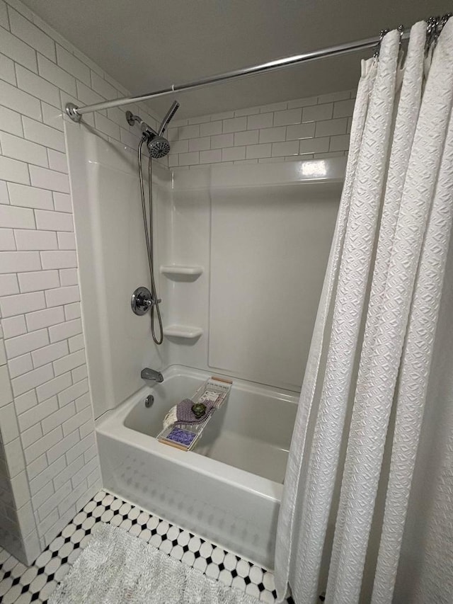168 14th St, Fond Du Lac, WI 54935 - bathroom featuring shower / tub combo and tile patterned floors