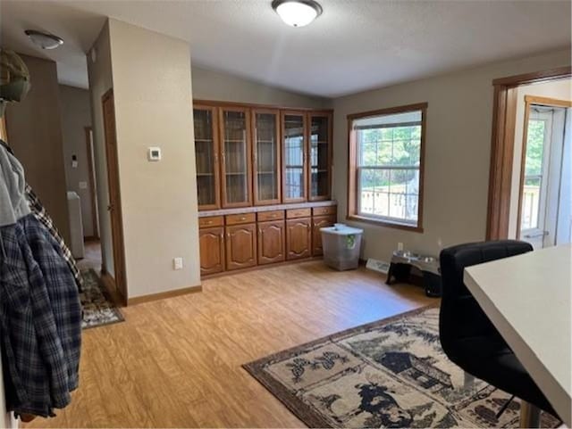 2779 250th Ave, Saint Croix Falls, WI 54024 - dining room with light wood-style flooring and vaulted ceiling