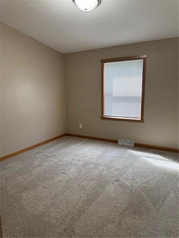 2779 250th Ave, Saint Croix Falls, WI 54024 - carpeted empty room featuring baseboards