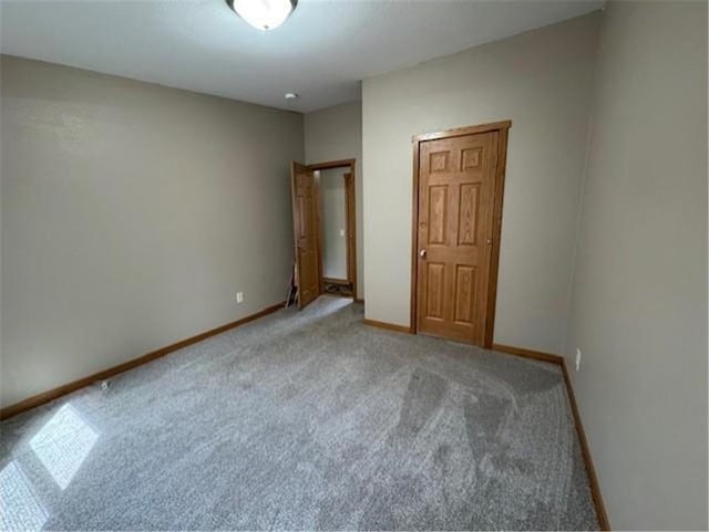 2779 250th Ave, Saint Croix Falls, WI 54024 - unfurnished bedroom with carpet flooring and baseboards