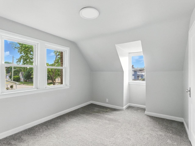 821 N 6th St, Manitowoc, WI 54220 - additional living space featuring vaulted ceiling and carpet