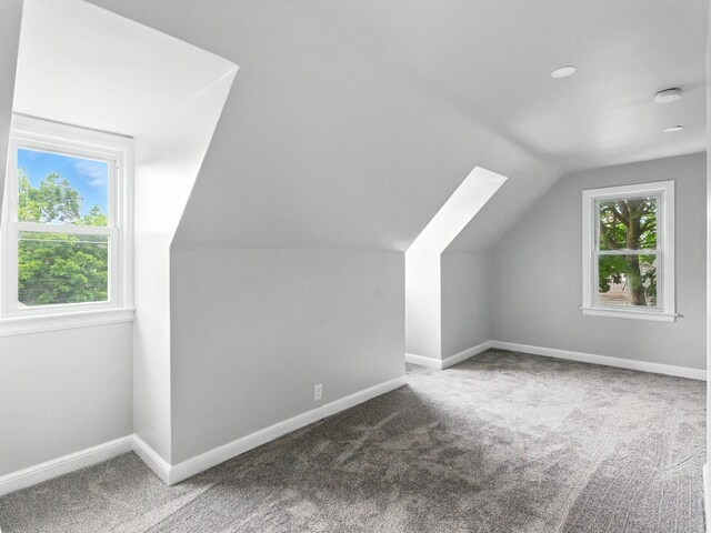 821 N 6th St, Manitowoc, WI 54220 - additional living space featuring vaulted ceiling and carpet flooring