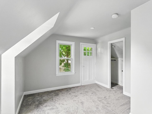 821 N 6th St, Manitowoc, WI 54220 - additional living space featuring lofted ceiling and carpet floors