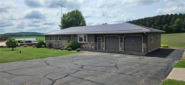 2931 148th Ave, Bloomer, WI 54724 - ranch-style home with an attached garage, a front lawn, driveway, and a metal roof