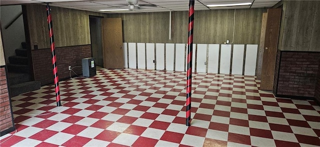2931 148th Ave, Bloomer, WI 54724 - finished below grade area featuring a drop ceiling, tile patterned floors, and wooden walls