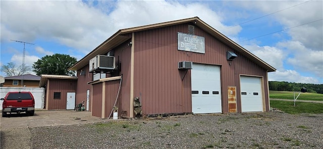 2931 148th Ave, Bloomer, WI 54724 - view of side of property with a garage, an outbuilding, and a wall mounted air conditioner