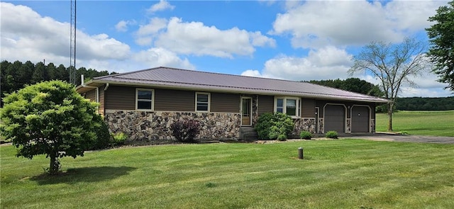 2931 148th Ave, Bloomer, WI 54724 - view of front of house with an attached garage, a front yard, driveway, a metal roof, and stone siding