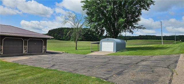 2931 148th Ave, Bloomer, WI 54724 - view of patio / terrace with an outdoor structure and a detached garage
