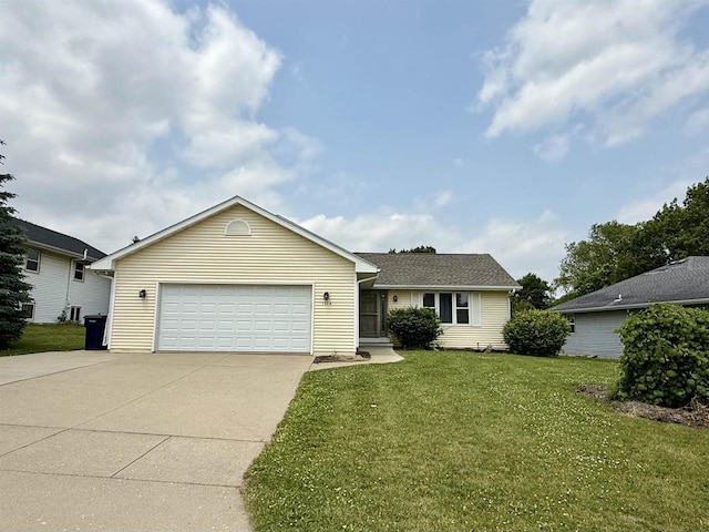 1335 Terapin Trl, Janesville, WI 53545 - view of front facade with concrete driveway, a front lawn, and a garage