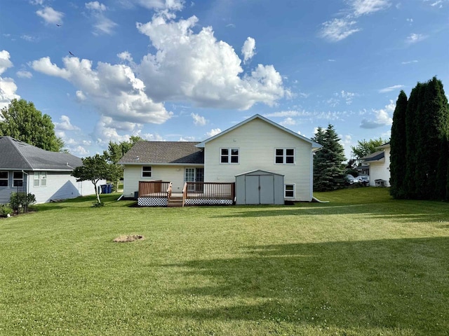 1335 Terapin Trl, Janesville, WI 53545 - back of property featuring a storage unit, a wooden deck, and a lawn