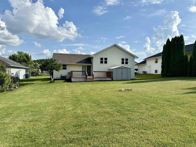1335 Terapin Trl, Janesville, WI 53545 - rear view of property featuring a storage unit, a deck, and a lawn