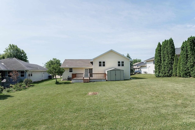 1335 Terapin Trl, Janesville, WI 53545 - rear view of house featuring a storage shed, a wooden deck, and a lawn