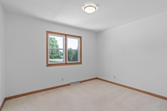 1335 Terapin Trl, Janesville, WI 53545 - spare room featuring baseboards and light colored carpet