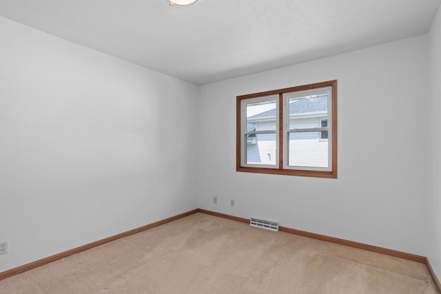 1335 Terapin Trl, Janesville, WI 53545 - spare room featuring light carpet and baseboards