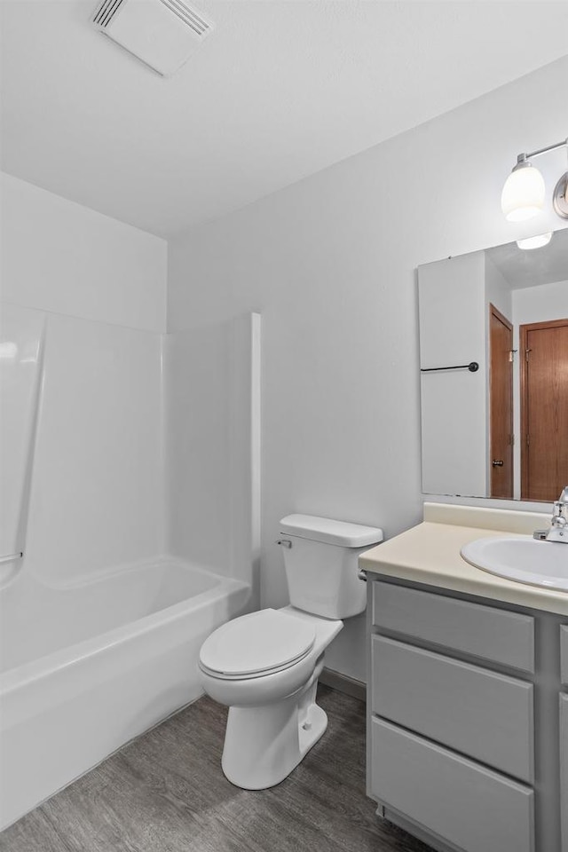 1335 Terapin Trl, Janesville, WI 53545 - full bathroom featuring wood finished floors, vanity, and bathtub / shower combination