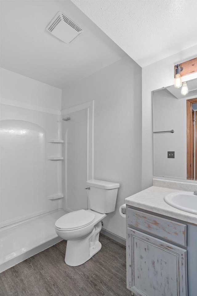 1335 Terapin Trl, Janesville, WI 53545 - bathroom with wood finished floors, vanity, and a shower