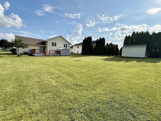 1335 Terapin Trl, Janesville, WI 53545 - view of grassy yard featuring a shed and a deck