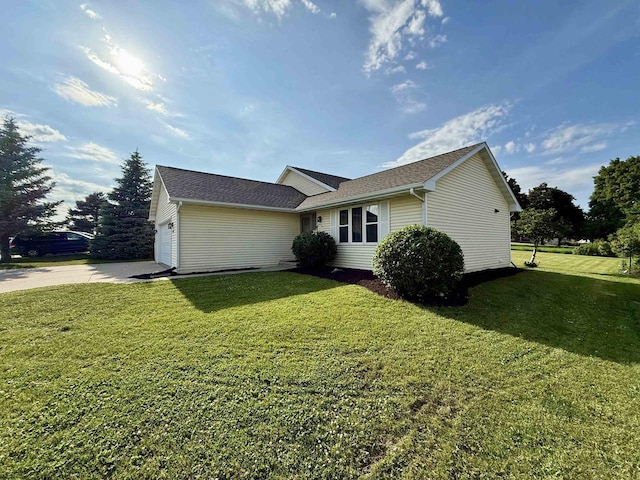 1335 Terapin Trl, Janesville, WI 53545 - view of front of house featuring a front lawn, a garage, concrete driveway, and a shingled roof