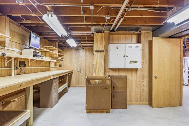 1602 Golden Oak Ln, Madison, WI 53711 - unfinished basement with a workshop area, wood walls, and freestanding refrigerator