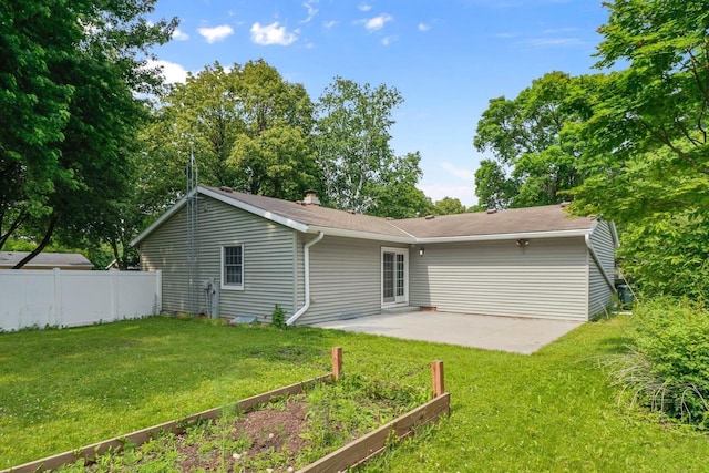 1602 Golden Oak Ln, Madison, WI 53711 - back of property with a patio area and a vegetable garden