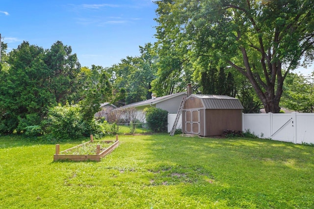 1602 Golden Oak Ln, Madison, WI 53711 - fenced backyard featuring a vegetable garden and a storage unit