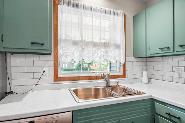 1602 Golden Oak Ln, Madison, WI 53711 - kitchen with green cabinets, light countertops, tasteful backsplash, and dishwashing machine