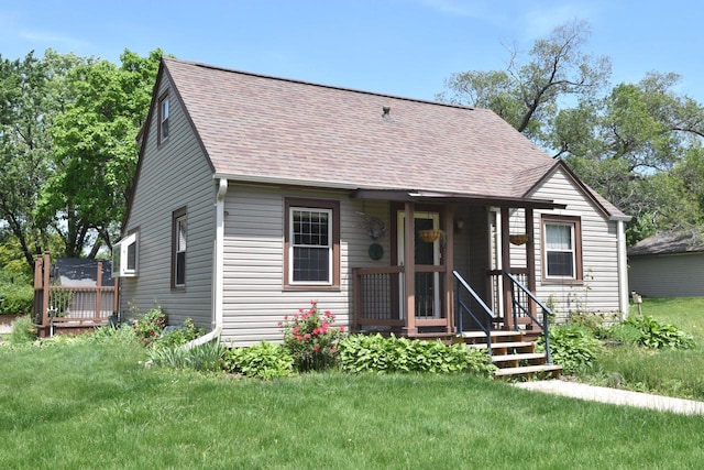 10526 W Congress St, Wauwatosa, WI 53225 - view of front of property featuring a shingled roof and a front yard